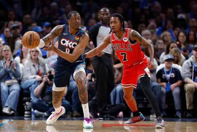 Mar 27, 2026; Oklahoma City, Oklahoma, USA; Oklahoma City Thunder guard Jalen Williams (8) passes around Chicago Bulls guard Rob Dillingham (7) during the second half at Paycom Center. Mandatory Credit: Alonzo Adams-Imagn Images