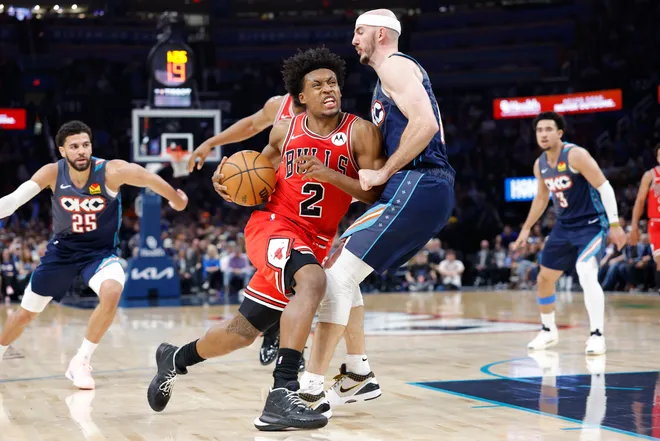 Mar 27, 2026; Oklahoma City, Oklahoma, USA; Chicago Bulls guard Collin Sexton (2) drives down the court against Oklahoma City Thunder guard Alex Caruso (9) during the second half at Paycom Center. Mandatory Credit: Alonzo Adams-Imagn Images