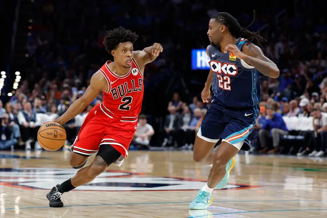 Mar 27, 2026; Oklahoma City, Oklahoma, USA; Chicago Bulls guard Collin Sexton (2) drives around Oklahoma City Thunder guard Cason Wallace (22) during the second half at Paycom Center. Mandatory Credit: Alonzo Adams-Imagn Images
