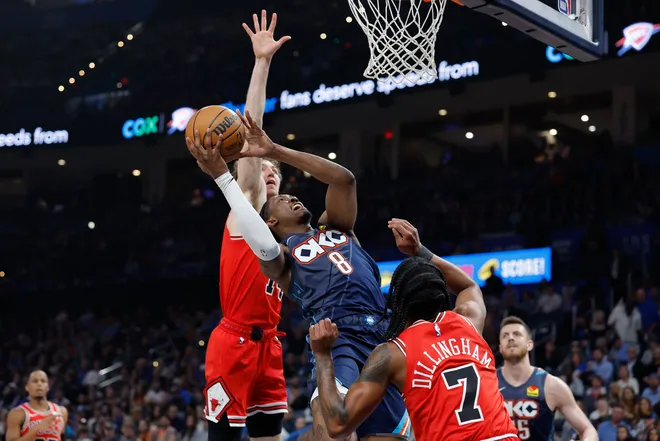 Mar 27, 2026; Oklahoma City, Oklahoma, USA; Oklahoma City Thunder guard Jalen Williams (8) goes up for a basket between Chicago Bulls forward Matas Buzelis (14) and guard Rob Dillingham (7) during the first quarter at Paycom Center. Mandatory Credit: Alonzo Adams-Imagn Images