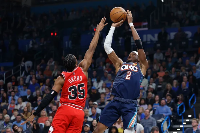 Mar 27, 2026; Oklahoma City, Oklahoma, USA; Oklahoma City Thunder guard Shai Gilgeous-Alexander (2) shoots as Chicago Bulls forward Isaac Okoro (35) defends during the first quarter at Paycom Center. Mandatory Credit: Alonzo Adams-Imagn Images