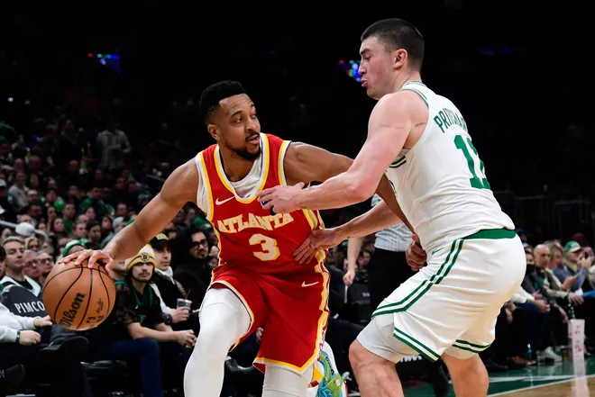 Mar 27, 2026; Boston, Massachusetts, USA; Atlanta Hawks guard CJ McCollum (3) dribbles against Boston Celtics guard Payton Pritchard (11) during the first half at TD Garden. Mandatory Credit: Bob DeChiara-Imagn Images