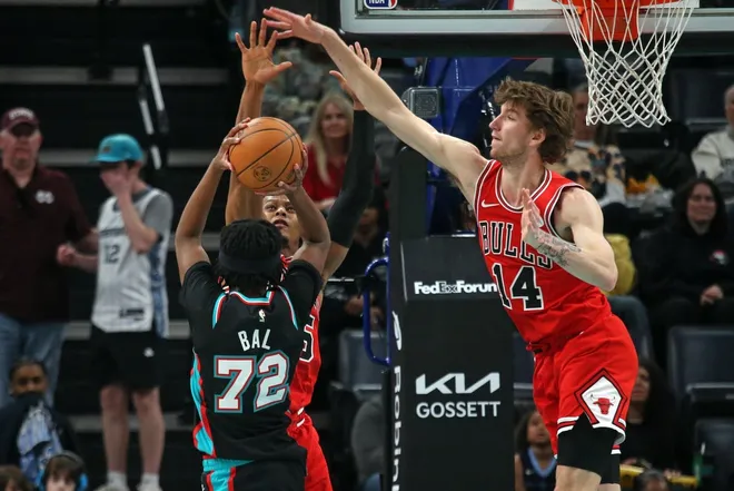 Mar 28, 2026; Memphis, Tennessee, USA; Memphis Grizzlies guard Adama Bal (72) shoots against Chicago Bulls forward Isaac Okoro (35) and Chicago Bulls forward Matas Buzelis (14) during the fourth quarter at FedExForum.