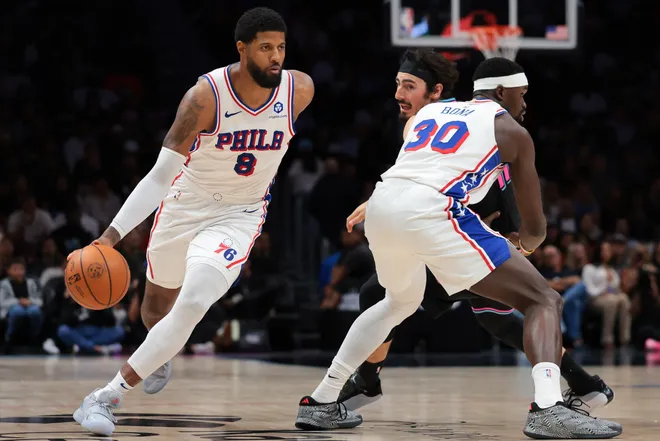 Mar 30, 2026; Miami, Florida, USA; Philadelphia 76ers forward Paul George (8) drives to the basket against Miami Heat forward Jaime Jaquez Jr. (11) during the third quarter at Kaseya Center. Mandatory Credit: Sam Navarro-Imagn Images