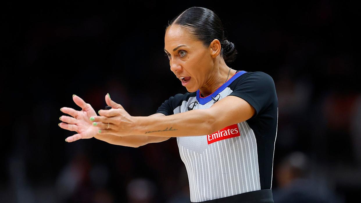 Referee Sha'Rae Mitchell signals