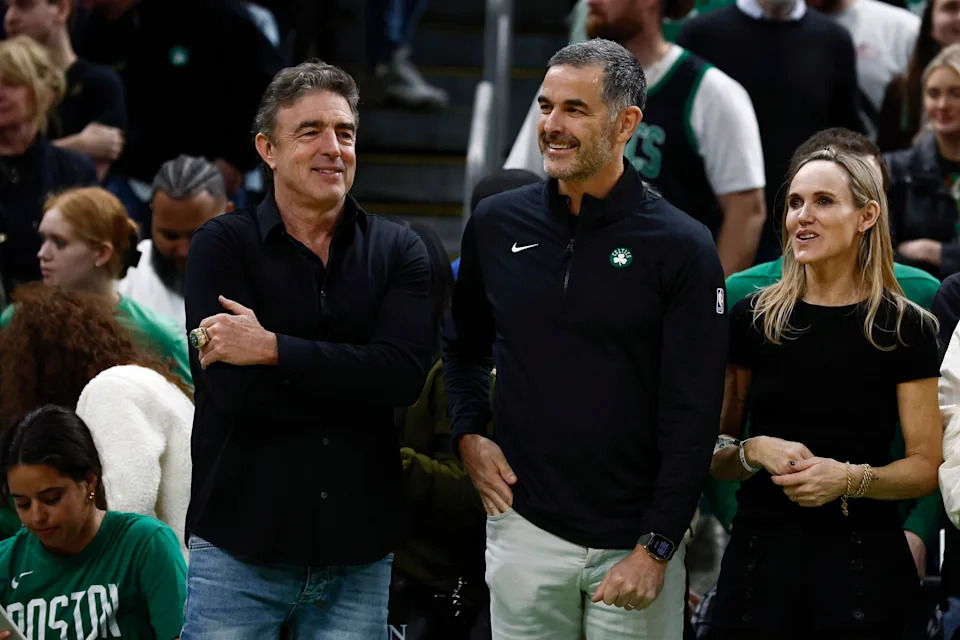 Apr 4, 2025; Boston, Massachusetts, USA; Bill Chisholm, center, who leads a group that is buying the Boston Celtics, stands with current owner Wyc Grousbeck and Chisholm’s wife, Kimberly Chisholm before the game between the Boston Celtics and the Phoenix Suns at TD Garden. Mandatory Credit: Winslow Townson-Imagn Images