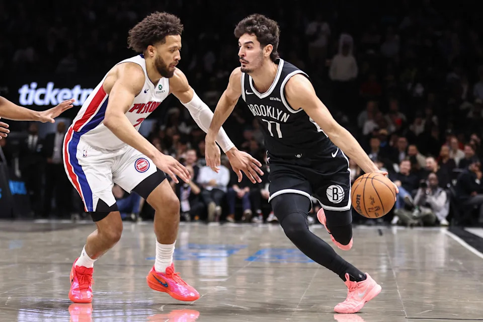 Brooklyn Nets guard Ben Saraf (77) drives past Detroit Pistons guard Cade Cunningham (2) in the first quarter at Barclays Center in New York on Tuesday, March 10, 2026.