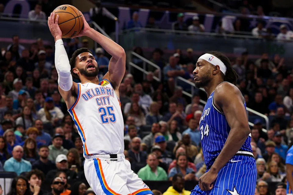Mar 17, 2026; Orlando, Florida, USA; Oklahoma City Thunder guard Ajay Mitchell (25) is fouled by Orlando Magic center Wendell Carter Jr. (34) in the fourth quarter at Kia Center. Mandatory Credit: Nathan Ray Seebeck-Imagn Images