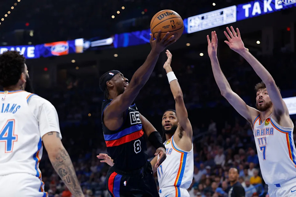 Mar 30, 2026; Oklahoma City, Oklahoma, USA; Detroit Pistons guard Caris LeVert (8) goes up for a basket between Oklahoma City Thunder defenders during the first half at Paycom Center. Mandatory Credit: Alonzo Adams-Imagn Images
