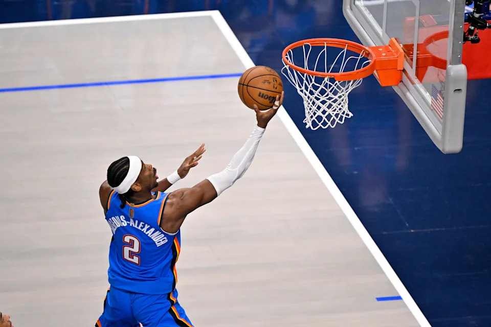 Mar 1, 2026; Dallas, Texas, USA; Oklahoma City Thunder guard Shai Gilgeous-Alexander (2) makes a layup shot Dallas Mavericks during the first quarter at the American Airlines Center. Mandatory Credit: Jerome Miron-Imagn Images