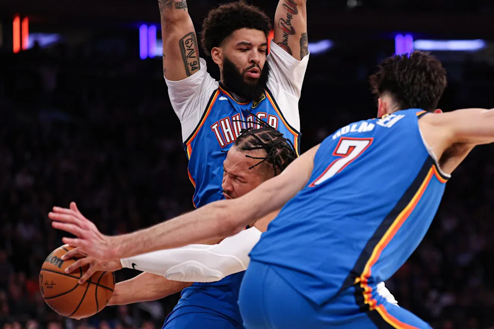 Mar 4, 2026; New York, New York, USA; New York Knicks guard Jalen Brunson (11) goes to the basket against Oklahoma City Thunder center Chet Holmgren (7) and guard Kenrich Williams (34) during the second half at Madison Square Garden. Mandatory Credit: Vincent Carchietta-Imagn Images