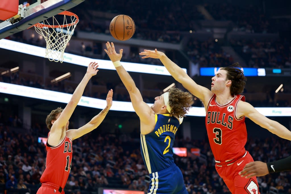 Brandin Podziemski drives to the basket against the double team. Getty Images