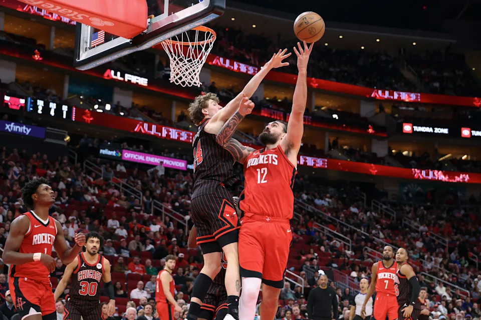 Jan 13, 2026; Houston, Texas, USA; Houston Rockets center Steven Adams (12) shoots the ball as Chicago Bulls forward Matas Buzelis (14) defends during the second half at Toyota Center. Mandatory Credit: Troy Taormina-Imagn Images
