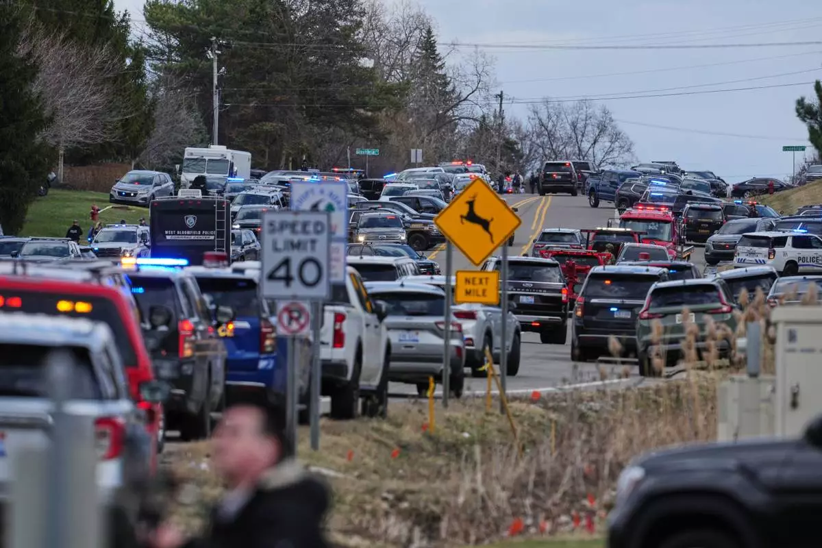 Law enforcement respond to a call at Temple Israel synagogue Thursday, March 12, 2026, in West Bloomfield Township, Mich. (AP Photo/Paul Sancya)