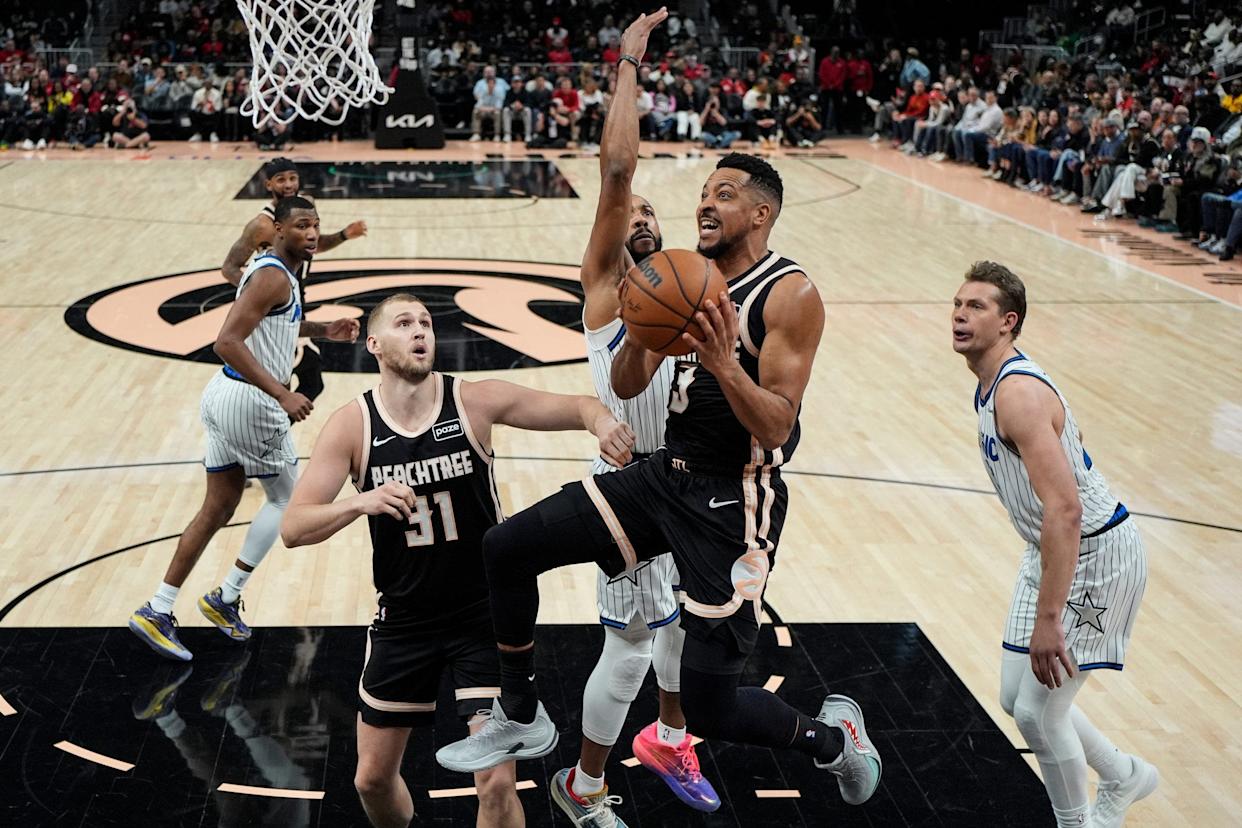 Atlanta Hawks player CJ McCollum drives to the basket