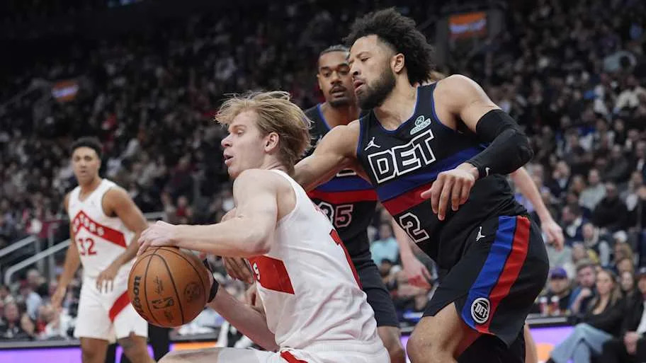 Detroit Pistons guard Cade Cunningham knocks the ball away from Toronto Raptors guard Gradey Dick