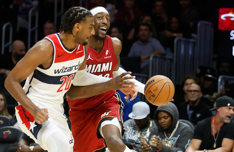 Mar 10, 2026; Miami, Florida, USA; Washington Wizards center Alex Sarr (20) defends Miami Heat center Bam Adebayo (13) during the first half at Kaseya Center. Mandatory Credit: Rhona Wise-Imagn Images