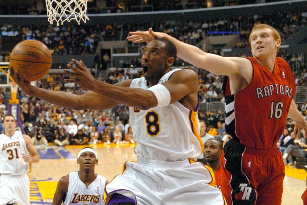 The Raptors' Matt Bonner can't stop the Lakers' Kobe Bryant from getting to the basket in the first half of NBA basketball action on Jan. 22, 2006, in Los Angeles. Bryant scored 81 points in the game as the Lakers beat the Raptors, 122-104. (AP Photo/Matt A. Brown, File)