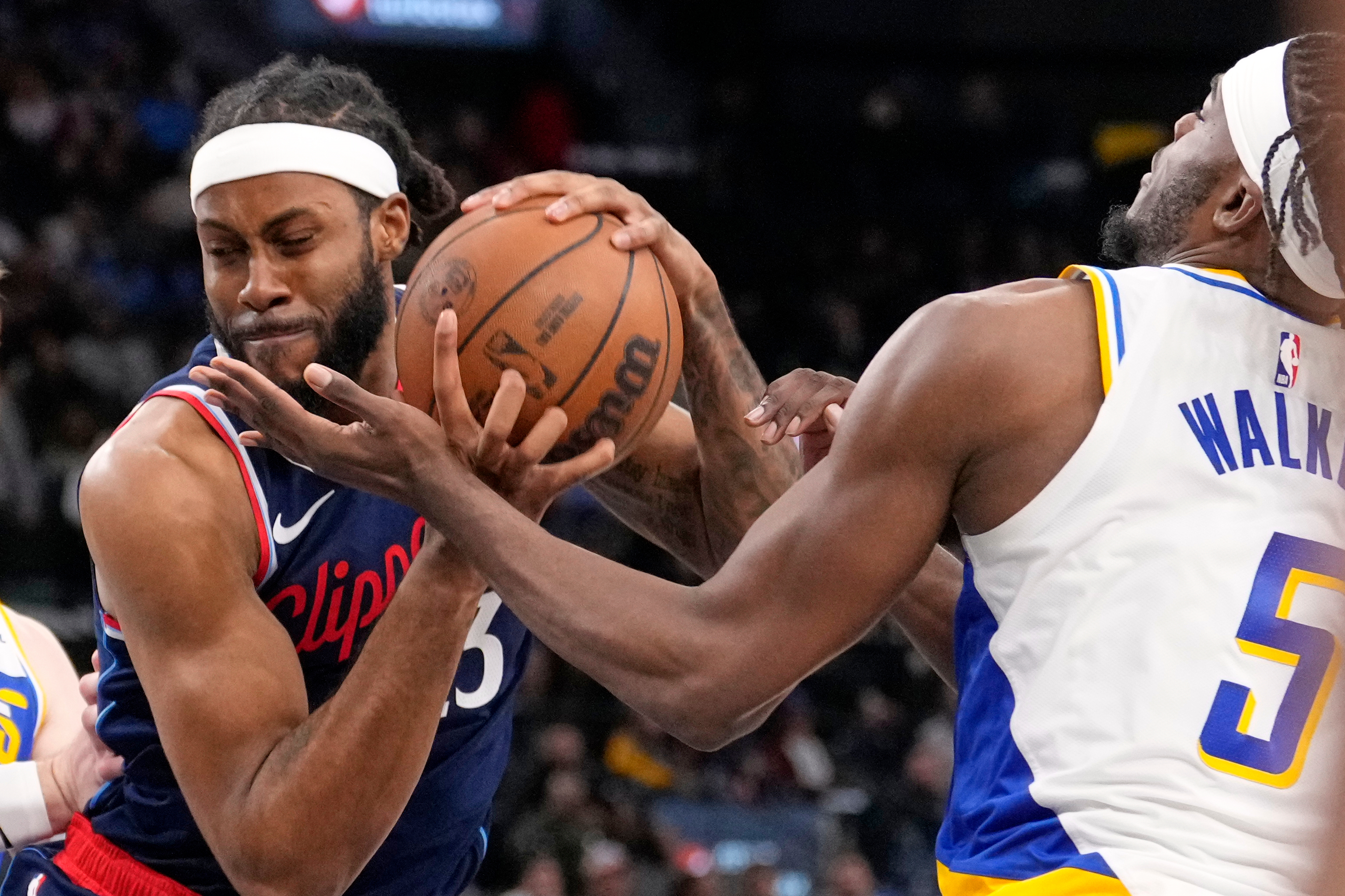 Clippers forward Isaiah Jackson, left, drives toward the basket as...