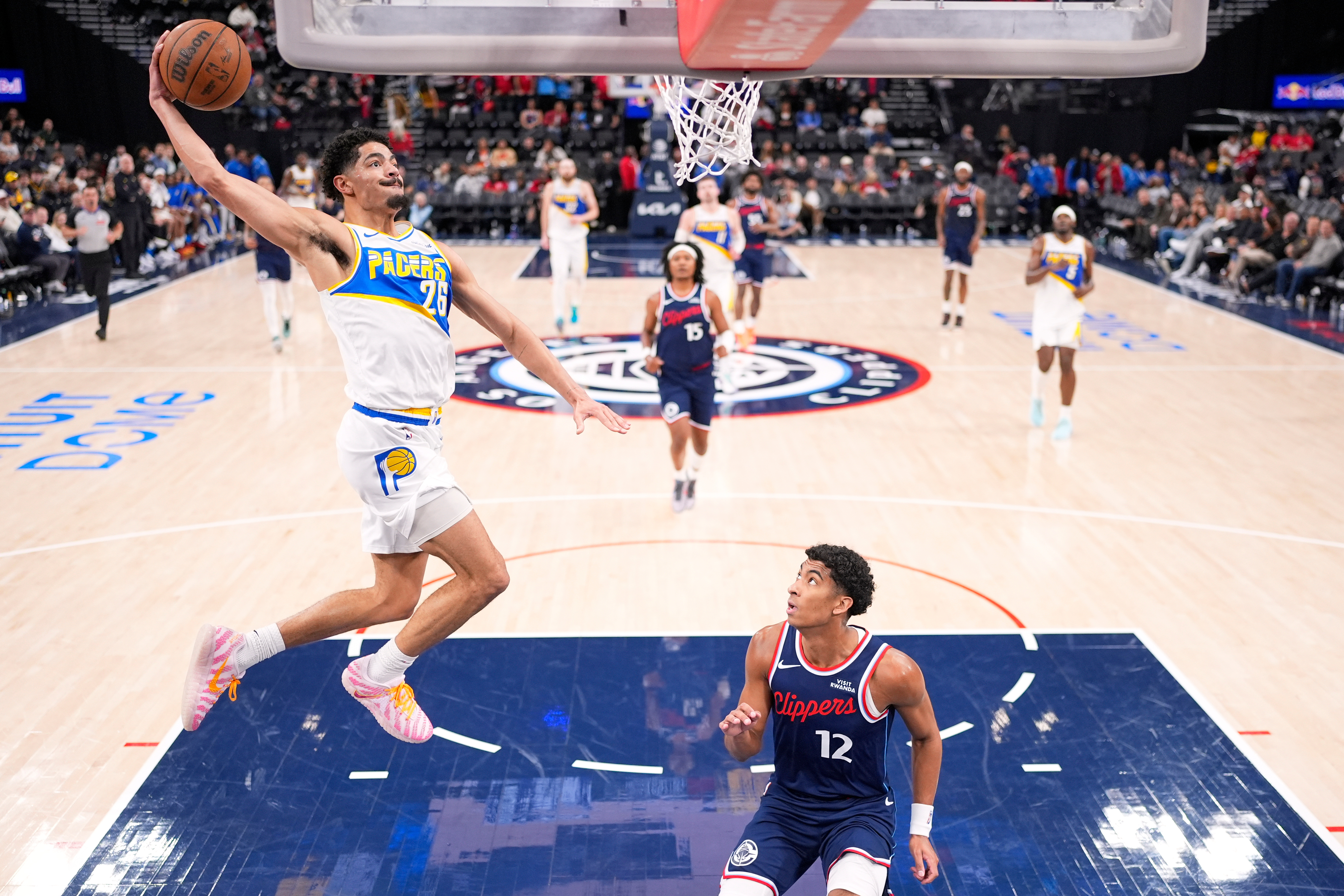 Indiana Pacers guard Ben Sheppard, left, goes up for a...