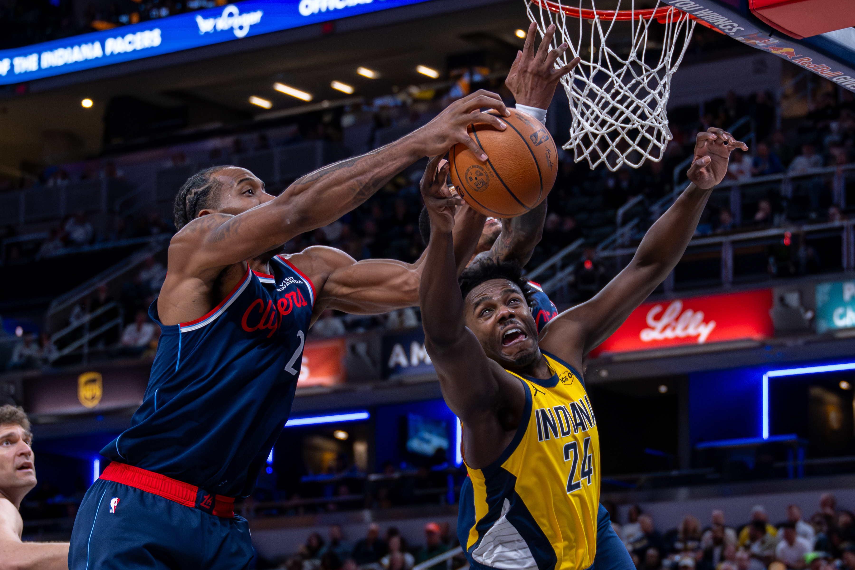Clippers star Kawhi Leonard, left, and Indiana Pacers guard Kobe...