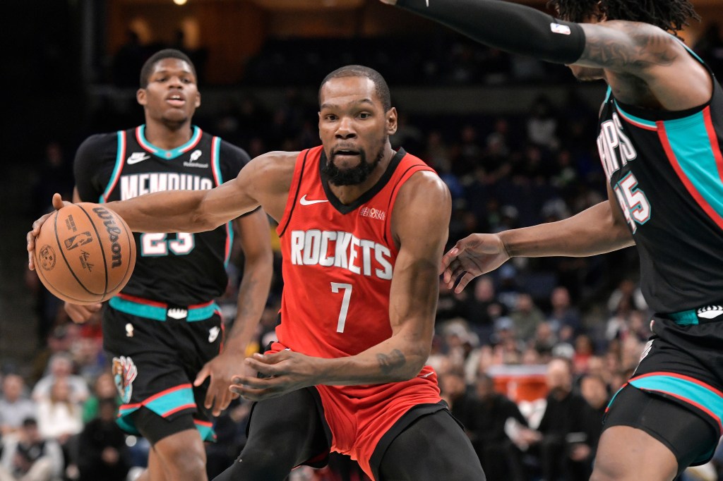 Houston Rockets forward Kevin Durant (7) handles the ball against Memphis Grizzlies forward GG Jackson II, right, in the first half of an NBA basketball game Friday, March 27, 2026, in Memphis, Tenn. 