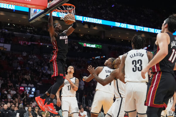 Miami Heat center Bam Adebayo (13) dunks during the second half of an NBA basketball game against the Brooklyn Nets, Tuesday, March 3, 2026, in Miami. (AP Photo/Lynne Sladky)