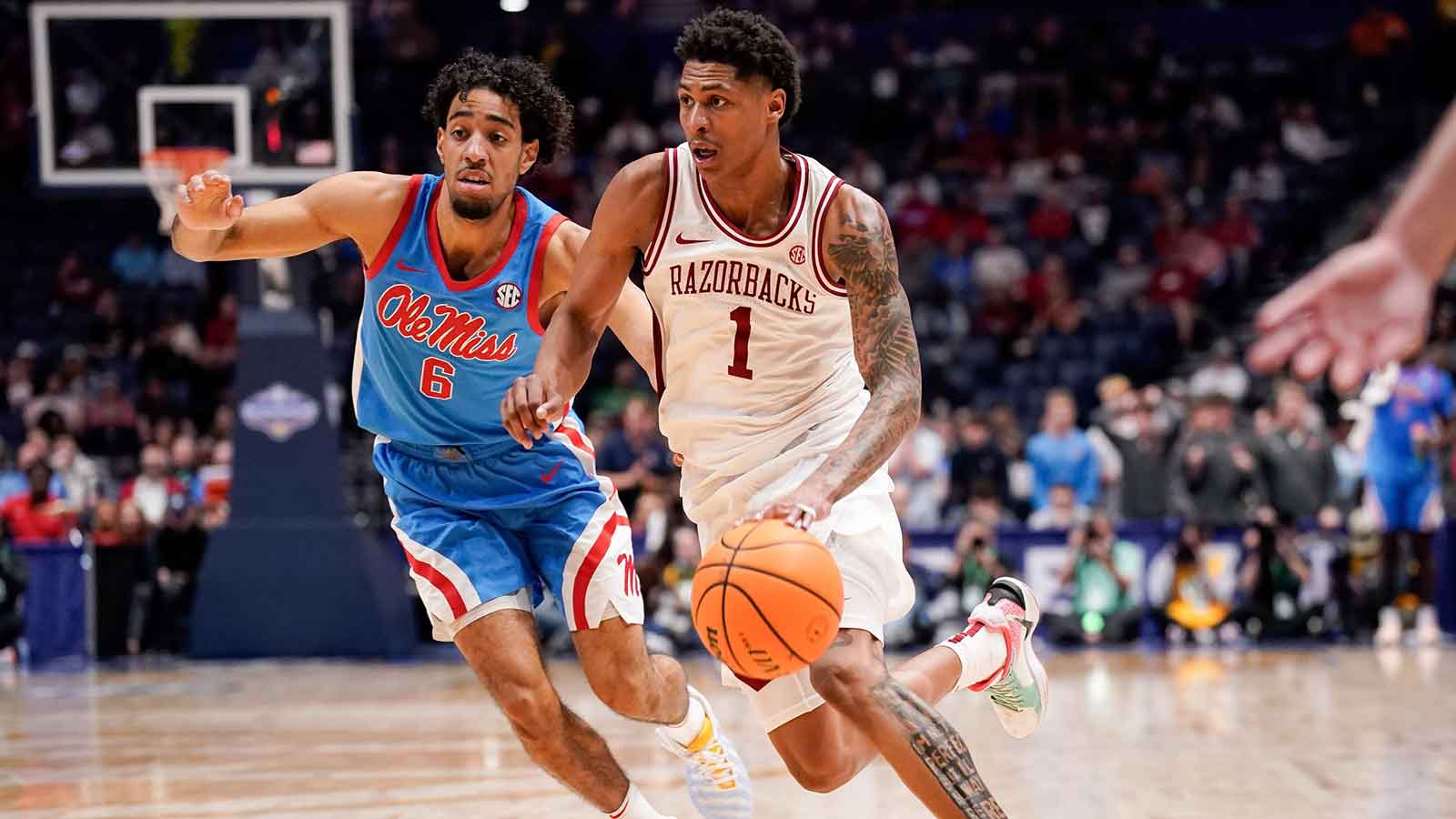 Arkansas guard Meleek Thomas (1) brings the ball up the court past Mississippi guard Ilias Kamardine (6) during the second half of a SEC tournament semifinal game at Bridgestone Arena in Nashville, Tenn.