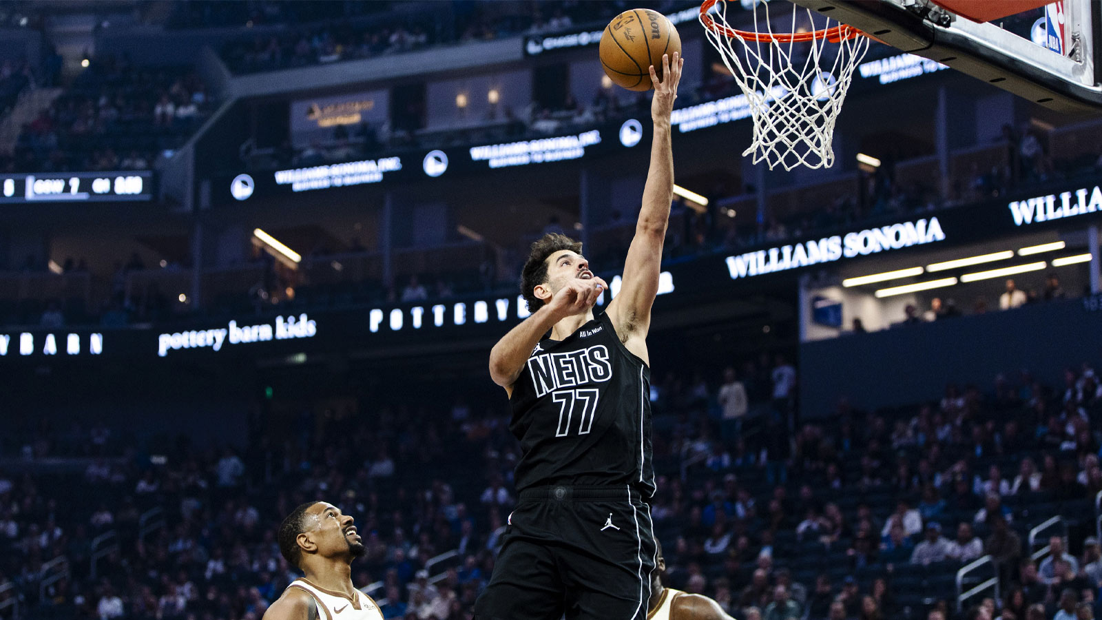Brooklyn Nets guard Ben Saraf (77) shoots against the Golden State Warriors during the first quarter at Chase Center.