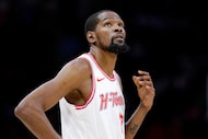 Houston Rockets forward Kevin Durant checks the scoreboard against the Portland Trail...