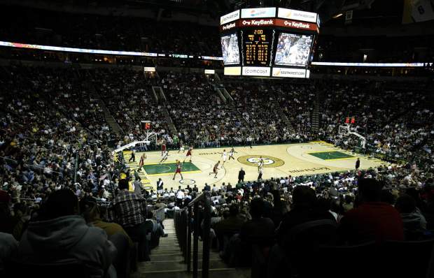 FILE - In this Jan. 16, 2007 file photo, the Seattle SuperSonics play the Cleveland Cavaliers in an NBA baseball game at KeyArena in Seattle. KeyArena is getting an appropriate send off Friday, Oct. 5, 2018, with an NBA game being played once again under its roof as the former home of the SuperSonics will see the Golden State Warriors meet the Sacramento Kings in a preseason game. Afterward, the building will be shuttered and remodeled. (AP Photo/Ted S. Warren, File)