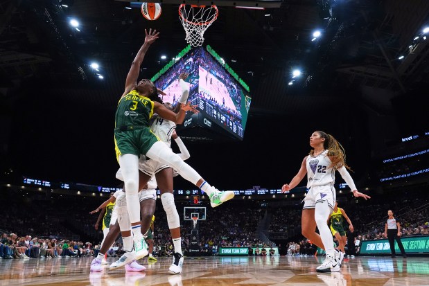 Seattle Storm forward Nneka Ogwumike (3) goes up for a basket against Golden State Valkyries center Temi Fagbenle, back left, as guard Veronica Burton (22) looks on during the second half of a WNBA basketball game Wednesday, July 16, 2025, in Seattle. (AP Photo/Lindsey Wasson)