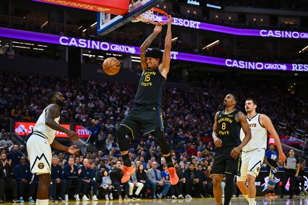 Golden State Warriors' Gui Santos (15) dunks the ball against the Denver Nuggets in the third quarter of their NBA game at Chase Center in San Francisco, Calif., on Sunday, Feb. 22, 2026. The Golden State Warriors defeated the Denver Nuggets 128-117. (Jose Carlos Fajardo/Bay Area News Group)