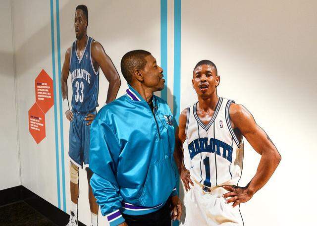 Muggsy Bogues checks out an exhibit in 2023 at the Charlotte Museum of History. Bogues, one of the most popular Hornets of all time, still tops the team’s all-time list in assists and steals.