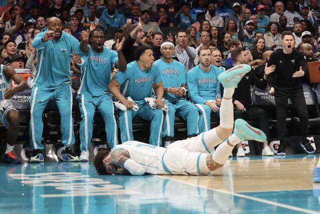 Charlotte Hornets players react as guard LaMelo Ball is fouled during the first quarter of the game against the Philadelphia 76ers on Saturday, March 28, 2026 at Spectrum Center in Charlotte.