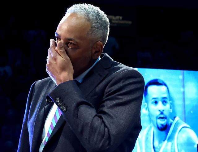 Former Charlotte Hornets forward Dell Curry becomes emotional after speaking to the fans during his jersey retirement ceremony at Spectrum Center on Thursday, March 19, 2026. The Charlotte Hornets retired Dell Curry's number 30 jersey and lifted a banner into the rafters during half time of the team's game against the Orlando Magic.