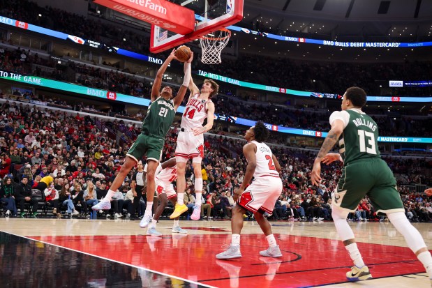 Chicago Bulls forward Matas Buzelis (14) blocks Milwaukee Bucks forward Ousmane Dieng (21) during the third quarter at the United Center on Sunday, March 1, 2026. (Eileen T. Meslar/Chicago Tribune)