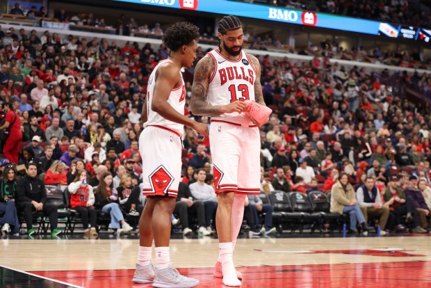 Chicago Bulls guard Collin Sexton (2) speaks to Chicago Bulls center Nick Richards (13) after he fell because he lost his shoe during the third quarter against the Milwaukee Bucks at the United Center on Sunday, March 1, 2026. (Eileen T. Meslar/Chicago Tribune)