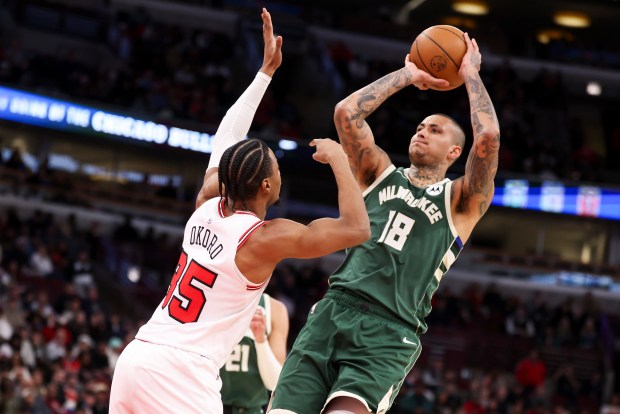 Milwaukee Bucks forward Kyle Kuzma (18) tries to shoot while under pressure from Chicago Bulls forward Isaac Okoro (35) during the fourth quarter at the United Center on Sunday, March 1, 2026. (Eileen T. Meslar/Chicago Tribune)