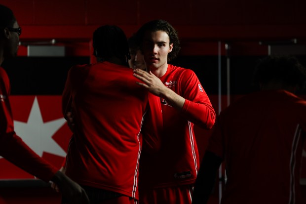 Chicago Bulls guard Josh Giddey (3) hugs other players before taking the court against the Toronto Raptors at the United Center March 18, 2026 in Chicago. (Armando L. Sanchez/Chicago Tribune)