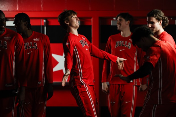Chicago Bulls forward Matas Buzelis (14) dances with other players before taking the court against the Toronto Raptors at the United Center March 18, 2026 in Chicago. (Armando L. Sanchez/Chicago Tribune)