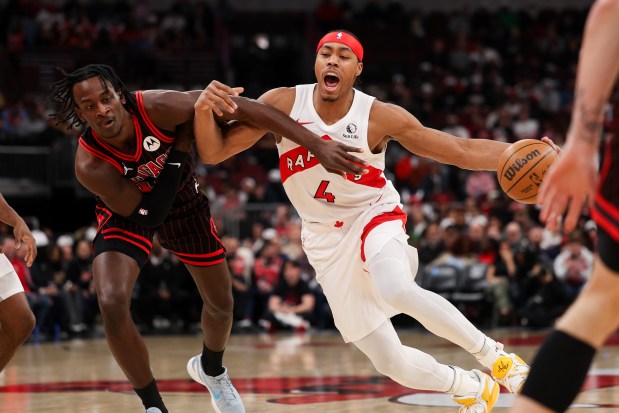 Chicago Bulls forward Leonard Miller (11) guards Toronto Raptors forward Scottie Barnes (4) during the first quarter at the United Center March 18, 2026 in Chicago. (Armando L. Sanchez/Chicago Tribune)