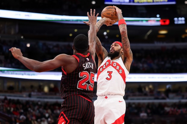 Chicago Bulls forward Jalen Smith (25) guards Toronto Raptors forward Brandon Ingram (3) while he goes up for a shot during the first quarter at the United Center March 18, 2026 in Chicago. (Armando L. Sanchez/Chicago Tribune)