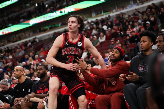 Chicago Bulls guard Josh Giddey (3) falls into the Bulls bench during the first quarter against the Toronto Raptors at the United Center March 18, 2026 in Chicago. (Armando L. Sanchez/Chicago Tribune)