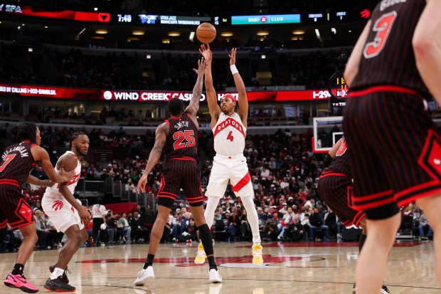 Toronto Raptors forward Scottie Barnes (4) goes up for a three-point shot over Chicago Bulls forward Jalen Smith (25) during the second quarter at the United Center March 18, 2026 in Chicago. (Armando L. Sanchez/Chicago Tribune)