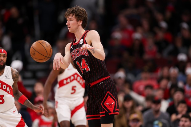 Chicago Bulls forward Matas Buzelis (14) passes the ball during the first quarter against the Toronto Raptors at the United Center March 18, 2026 in Chicago. (Armando L. Sanchez/Chicago Tribune)