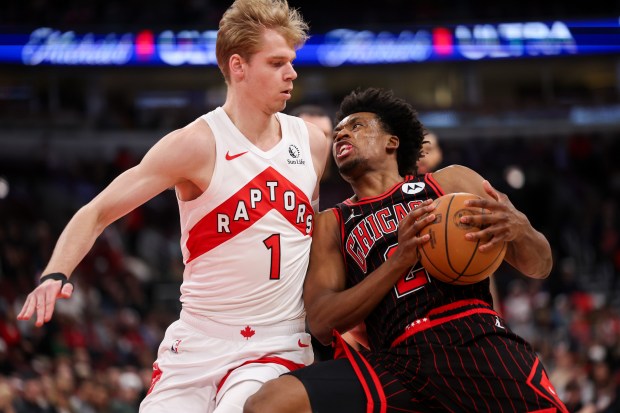 Toronto Raptors guard Gradey Dick (1) guards Chicago Bulls guard Collin Sexton (2) during the fourth quarter at the United Center March 18, 2026 in Chicago. (Armando L. Sanchez/Chicago Tribune)