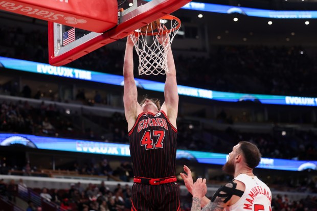 Chicago Bulls center Lachlan Olbrich (47) dunks the ball during the fourth quarter against the Toronto Raptors at the United Center March 18, 2026 in Chicago. (Armando L. Sanchez/Chicago Tribune)