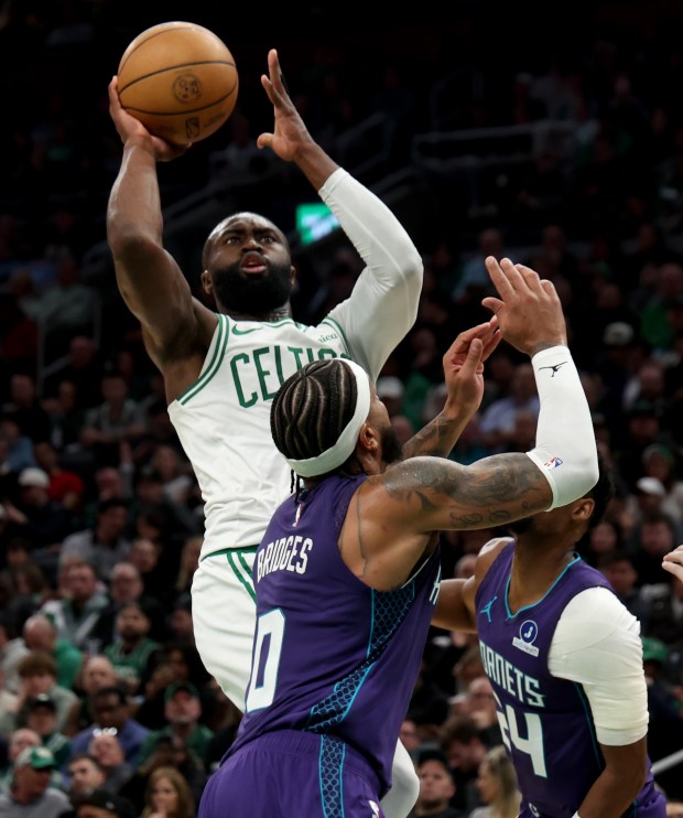 Boston Celtics guard Jaylen Brown shoots above Charlotte Hornets forward Miles Bridges during the first quarter at TD Garden. (Matt Stone/Boston Herald)