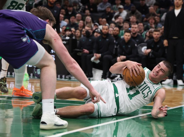 Boston Celtics guard Payton Pritchard goes down hard during the first quarter at TD Garden. (Matt Stone/Boston Herald)
